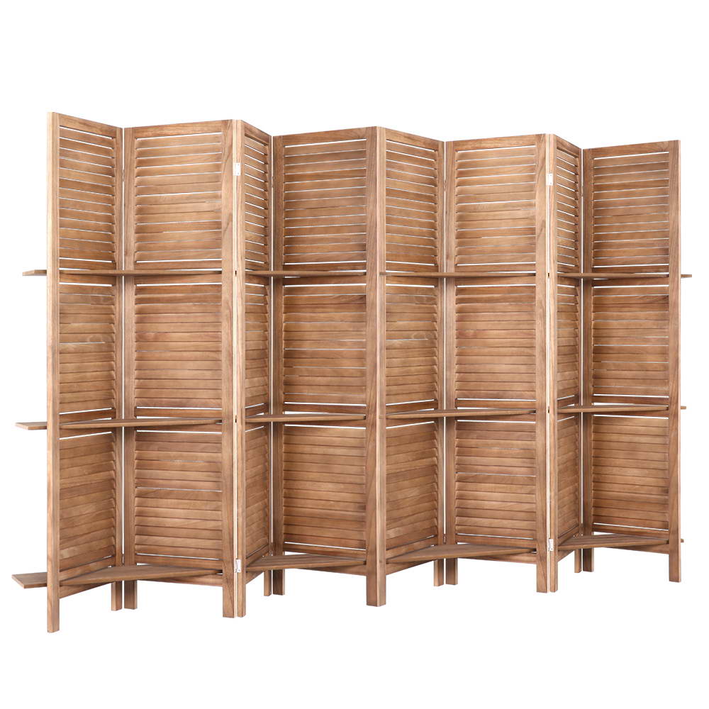 Natural 8-panel louvered wood room divider with three built-in shelves angled view on white background with shelf rails