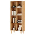 8-cube bookcase in natural oak with tapered legs, styled with books and decor, slight angle on white background