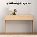 Natural oak console table with slat side panels in styled room, lamp and plant on top, text reads 40KG weight capacity