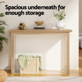 Natural oak console table in living room with wicker basket underneath, text 