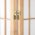 Natural pine shoji room divider gold brass two-way metal hinge close-up between two wood frame panels