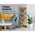 Natural wood 7-tier tree bookshelf in grey living room, text Unique presence Freestanding or wall-mounted