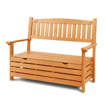 Light natural wood garden storage bench with slatted backrest and armrests, slatted storage base, three-quarter angle