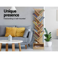 Natural wood tree bookshelf in living room lifestyle with text Unique presence Freestanding or wall-mounted