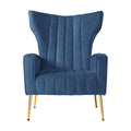 Navy blue velvet wingback armchair with vertical channel tufting and gold metal legs, direct front view on white background