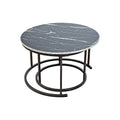 Round coffee table with black marble-pattern top, dark metal ring base, angle view with smaller nested table visible