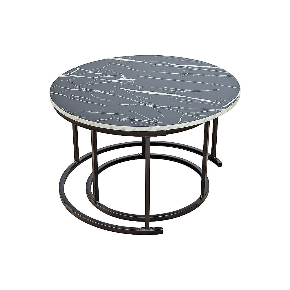 Round coffee table with black marble-pattern top, dark metal ring base, angle view with smaller nested table visible