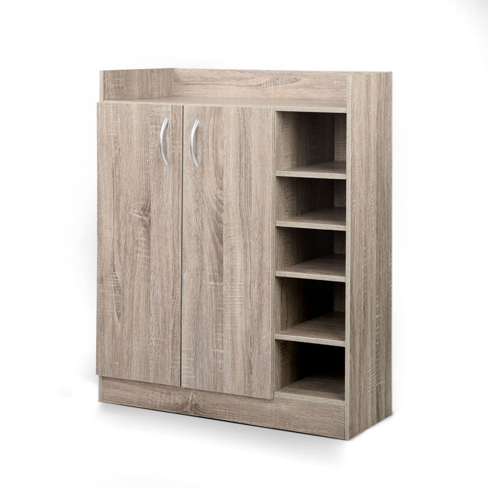 Oak finish 2-door shoe cabinet with 5 open side shelves angled view on white background