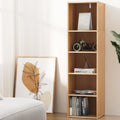 Tall narrow oak-finish 5-shelf bookcase styled in living room with books, model motorcycle, and decorative items