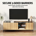 Oak and black TV unit secure 3-sided barriers feature lifestyle with gaming items on raised back-railed top surface
