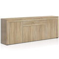 Natural oak finish buffet sideboard with one left door, central drawer, and two right cabinet doors, three-quarter angle view