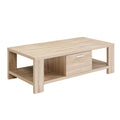 Light oak coffee table three-quarter view with one right-side drawer and open lower shelf on white background