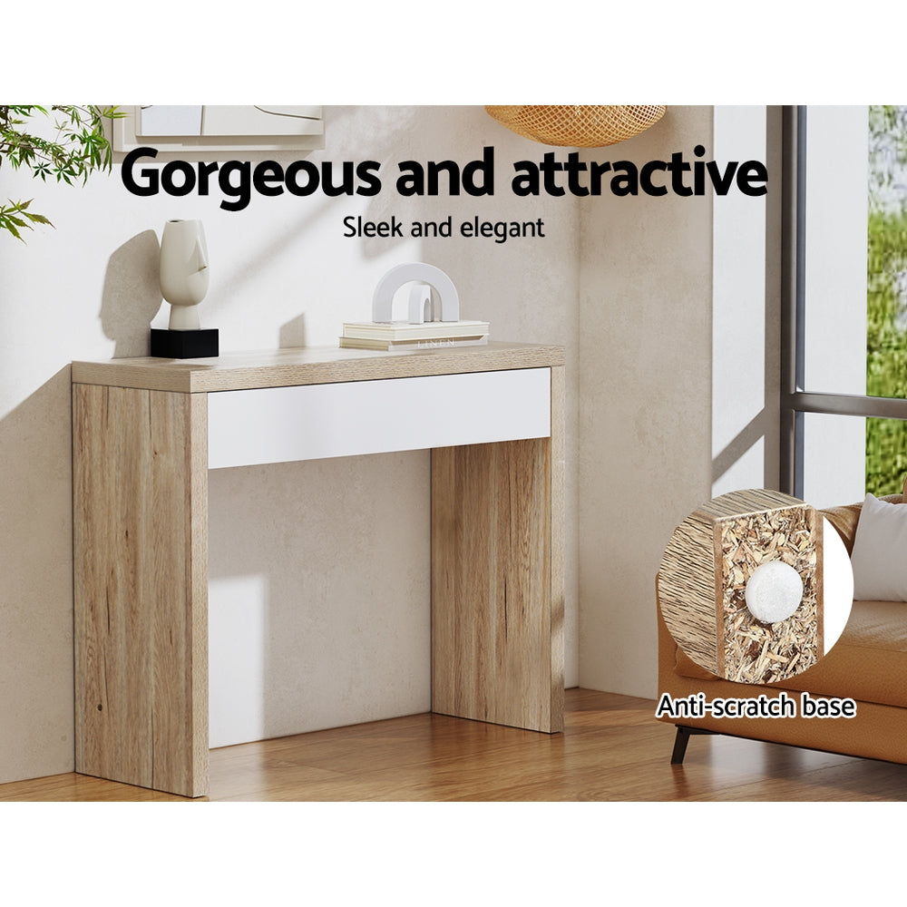 Oak console table with white drawer in room setting near window; callout: anti-scratch base detail