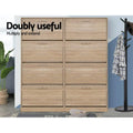 Two oak 4-door flip shoe cabinets side by side in room with coat stand, doubly useful text