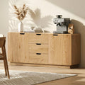 Oak grain sideboard in dining room with coffee machine and vase on top, three central drawers and two side doors