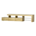 Oak finish stepped 215cm LED TV unit product shot on white background with glass shelves and drawers