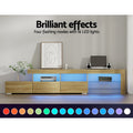 Oak LED TV unit 215cm in living room with blue LED glow and 16 LED colour swatches strip below unit