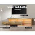 Oak LED TV unit 215cm with orange LED showing 90kg surface capacity and 10kg drawer capacity labels