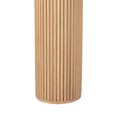 Close-up of cylindrical fluted column base on oak console table, vertical reeded detail and rounded foot, white background