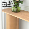 Oak console oval top with green vase; fluted column below; text 
