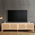 Oak and rattan TV unit in grey concrete room with wall-mounted TV pendant light copper mug and small plant
