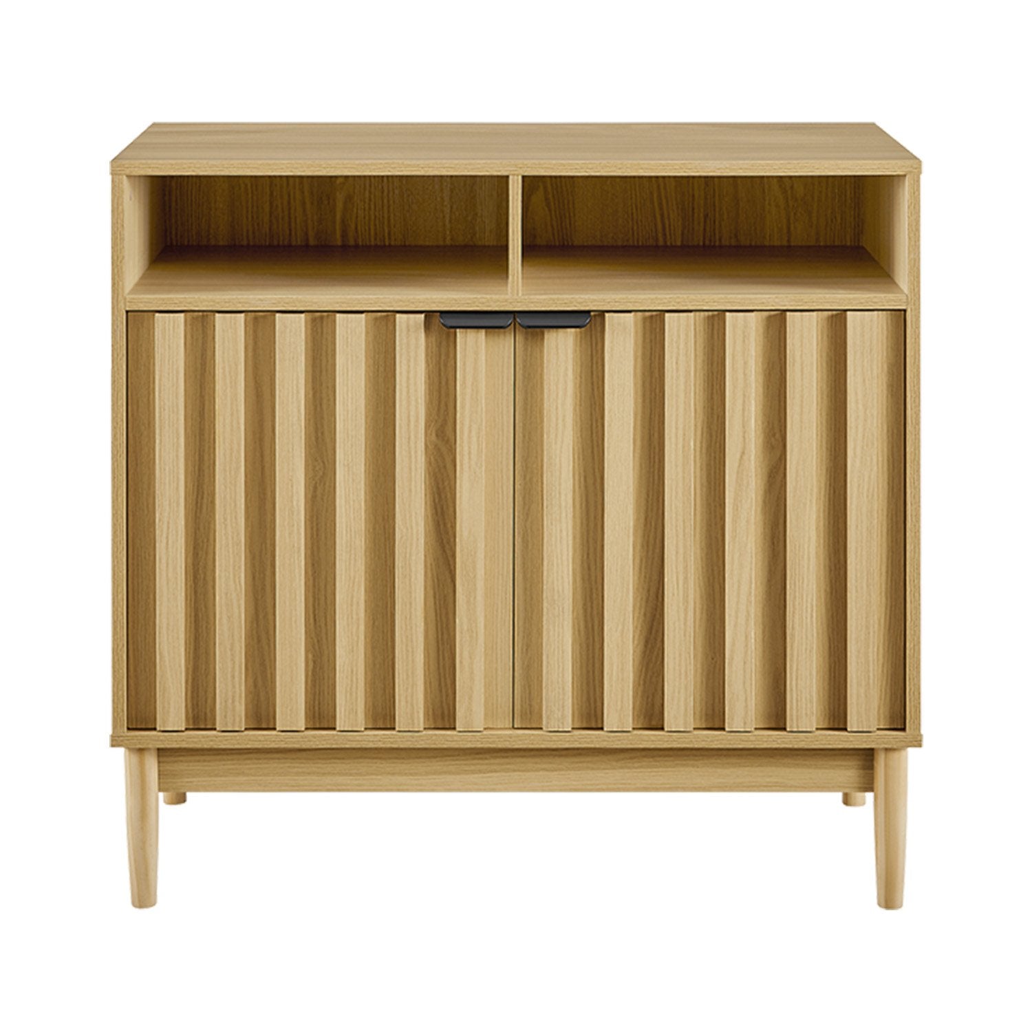 Natural oak reeded cabinet front view, two open top compartments and two lower reeded doors, black bar handles, tapered legs