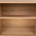 Close-up interior view of oak reeded sideboard showing two empty shelves with wood grain finish