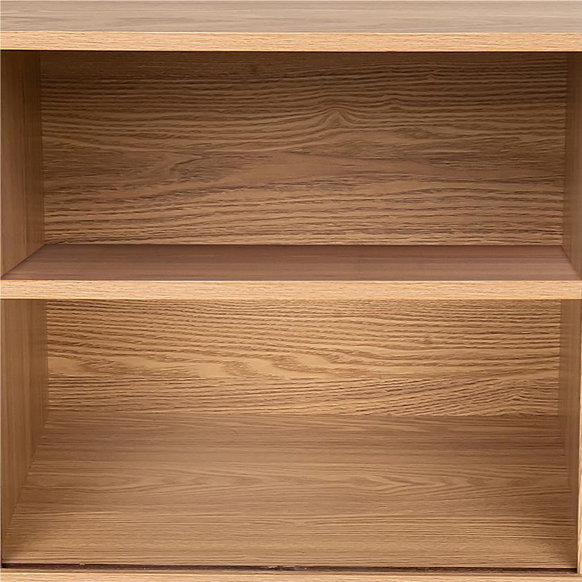 Close-up interior view of oak reeded sideboard showing two empty shelves with wood grain finish