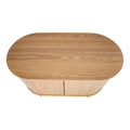 Top-down view of oak reeded sideboard showing oval top with wood grain and reeded door panels below