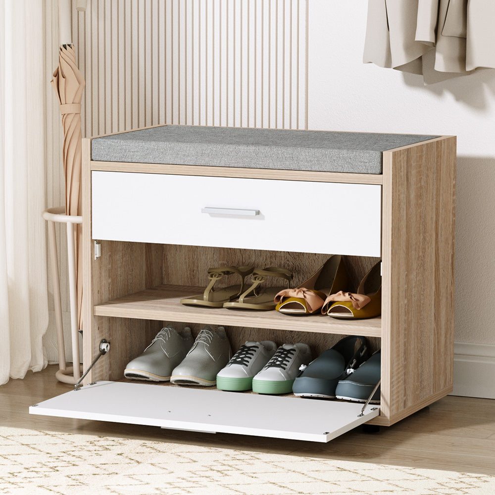 Oak shoe bench with grey cushion white drawer bar handle two open shelves and flip-down tray open showing shoes in lifestyle