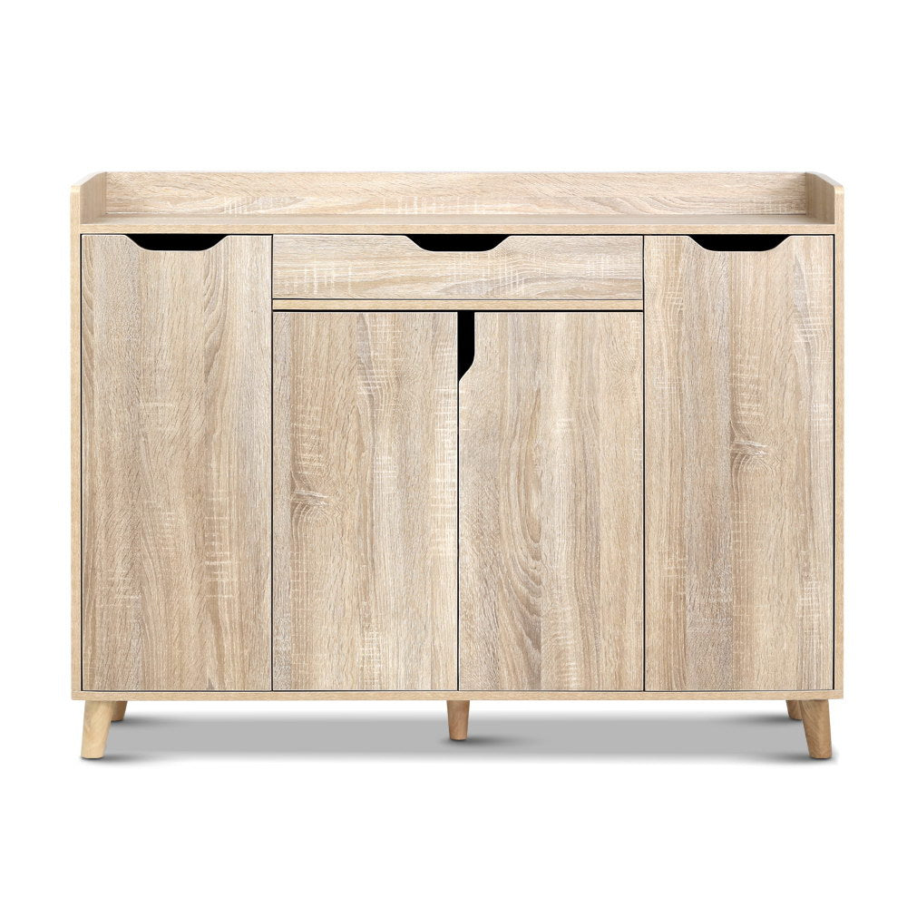 Oak finish shoe cabinet front view top gallery rail drawer three lower doors natural wood legs on white background