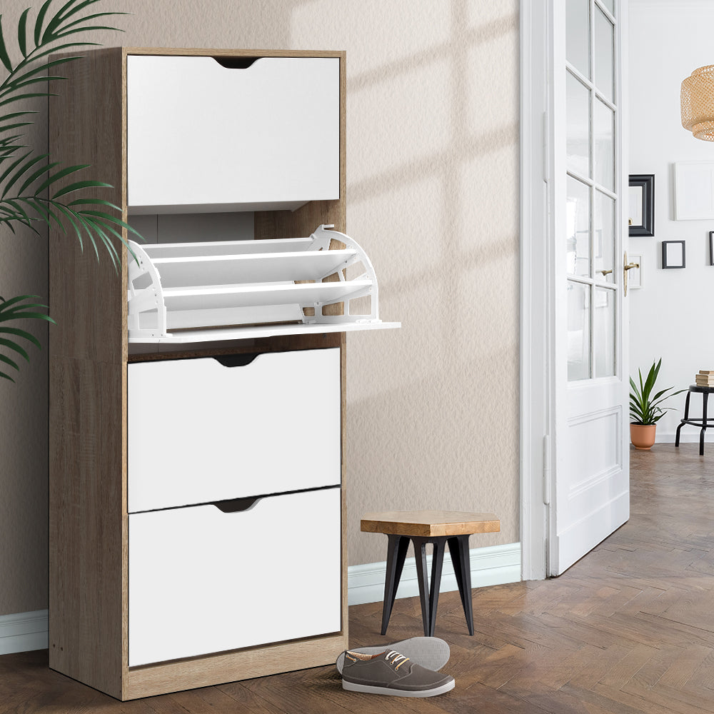 Tall oak shoe cabinet 4-door white panel middle section deployed showing shoe rack mechanism in hallway with plant