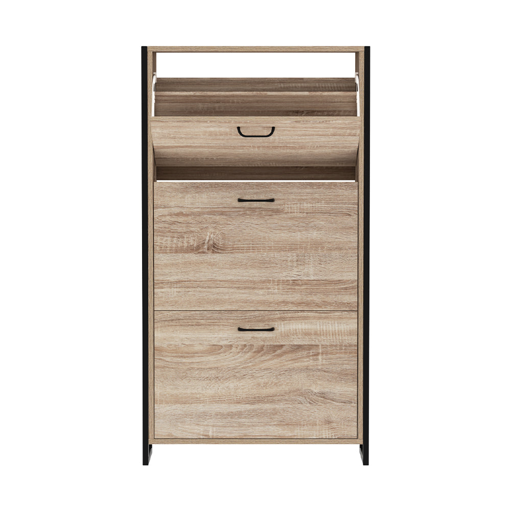 Oak finish shoe cabinet with black metal frame and three closed flip-down doors with open top shelf on white background