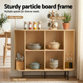 Oak sideboard with four open compartments loaded with kitchenware in kitchen, labels show 20kg and 10kg shelf capacity