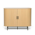 Natural oak sideboard with rounded ends and two closed ribbed sliding doors with black handles on metal base, front view