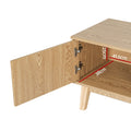 Open cabinet door on oak TV stand showing hinge detail and interior dimensions 25cm by 41.5cm by 38cm