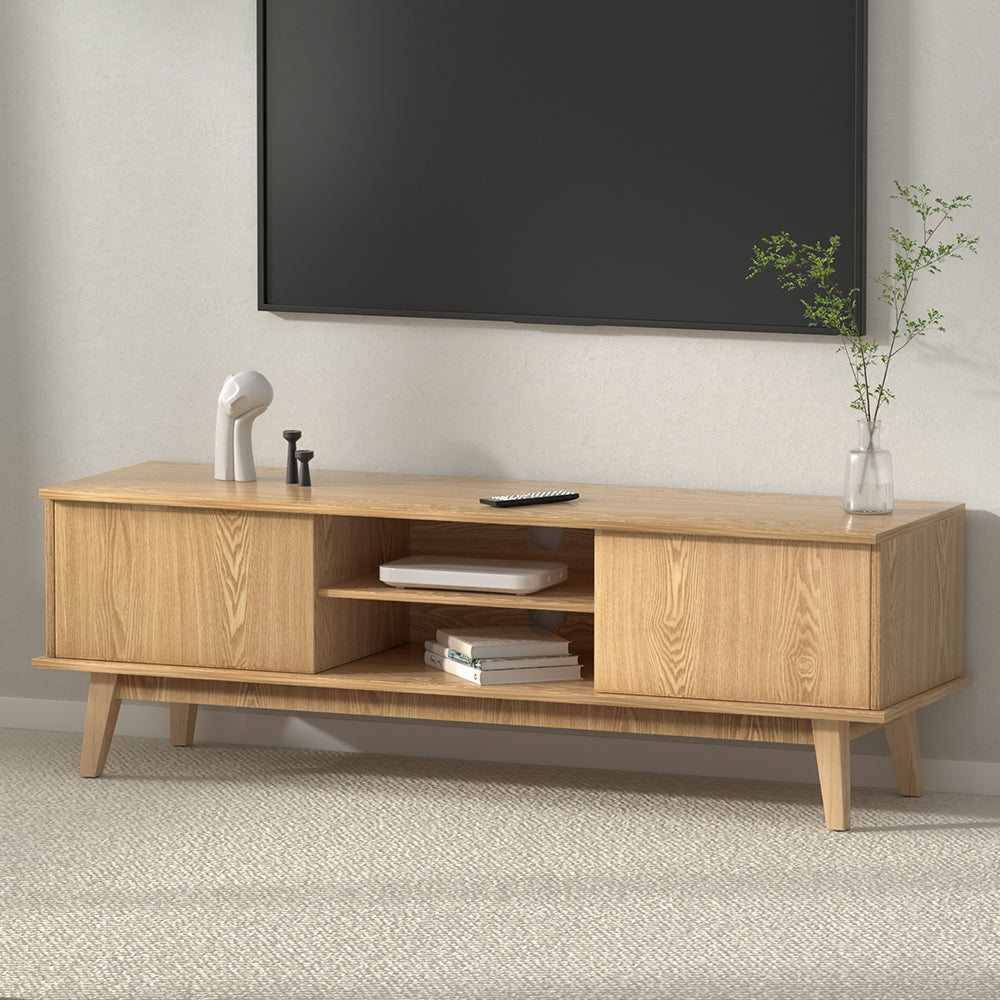 Oak 140cm TV stand in living room with wall-mounted TV, open shelf and two side cabinet doors