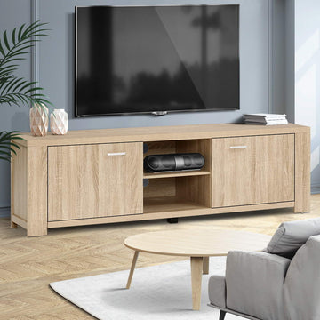 Oak TV stand 160cm in living room with wall-mounted TV grey sofa geometric vases on top and palm plant