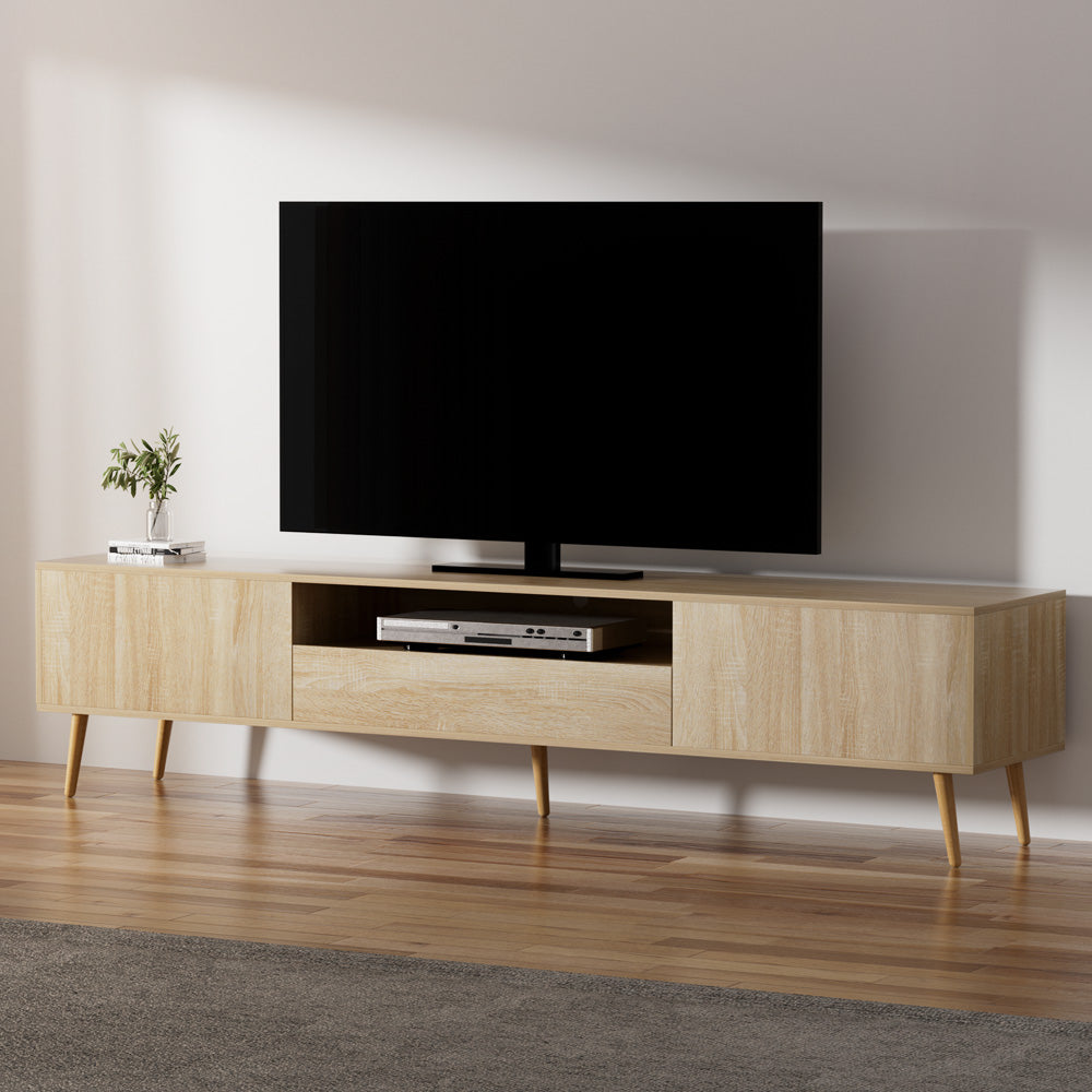Oak 200cm TV unit in room with TV on top 1 door each side open shelf with DVD player and centre drawer