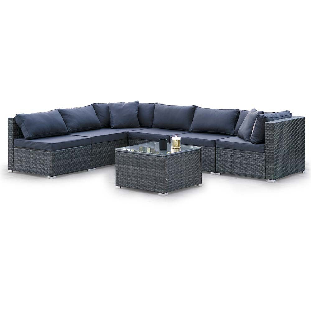 6-piece dark grey wicker outdoor sectional sofa set with navy cushions in L-shape and glass-top coffee table