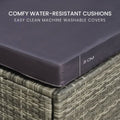 Close-up of wicker sofa corner with 8cm thick dark grey seat cushion and text: comfy water-resistant cushions machine washable