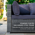 Outdoor wicker sofa end with dark grey cushions and text: powder coated galvanised steel frame no rust stains outdoors