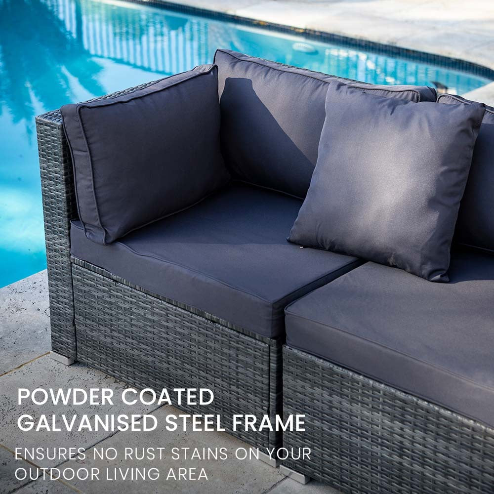 Wicker sofa corner with charcoal cushions by pool and text: powder coated galvanised steel frame ensures no rust stains