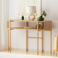 Oak oval console table against white wall in living room, lamp and green vases on top, books and decor on lower shelf