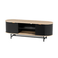Oval oak-top black fluted TV unit angle view on white oval top two fluted doors and center open shelves