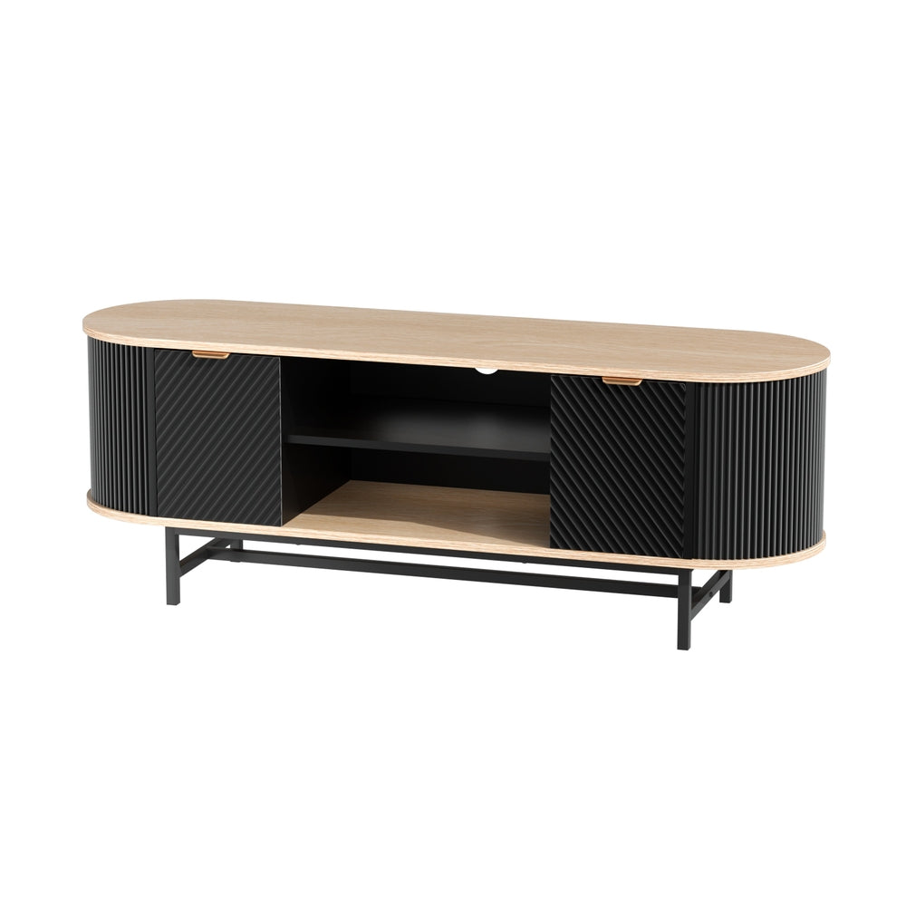 Oval oak-top black fluted TV unit angle view on white oval top two fluted doors and center open shelves