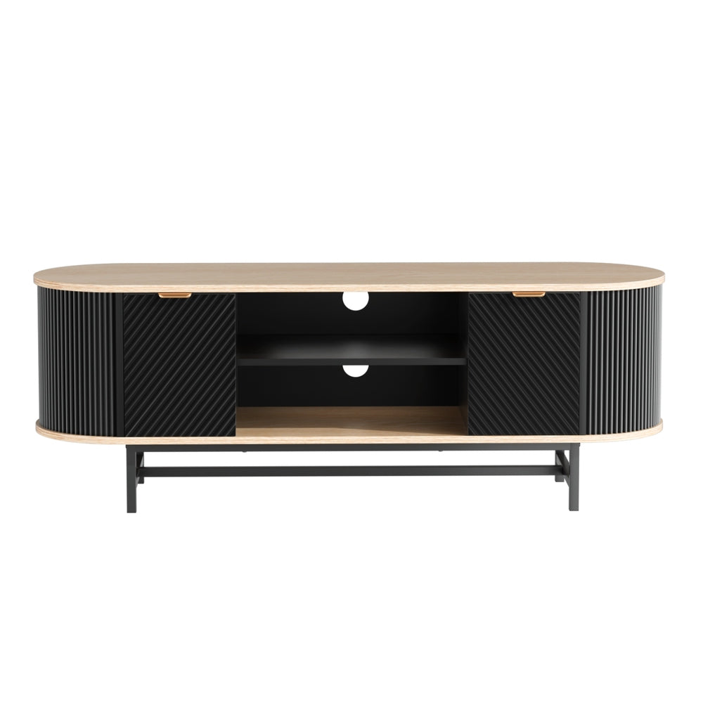 Oval oak-top black fluted TV unit front view on white two fluted doors center shelves cable hole black X-frame legs