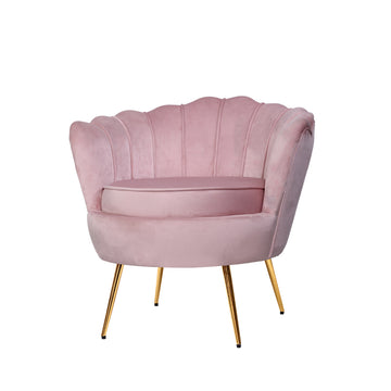 Pink velvet scallop shell-back chair with channel stitching and gold metal legs, angle view on white background