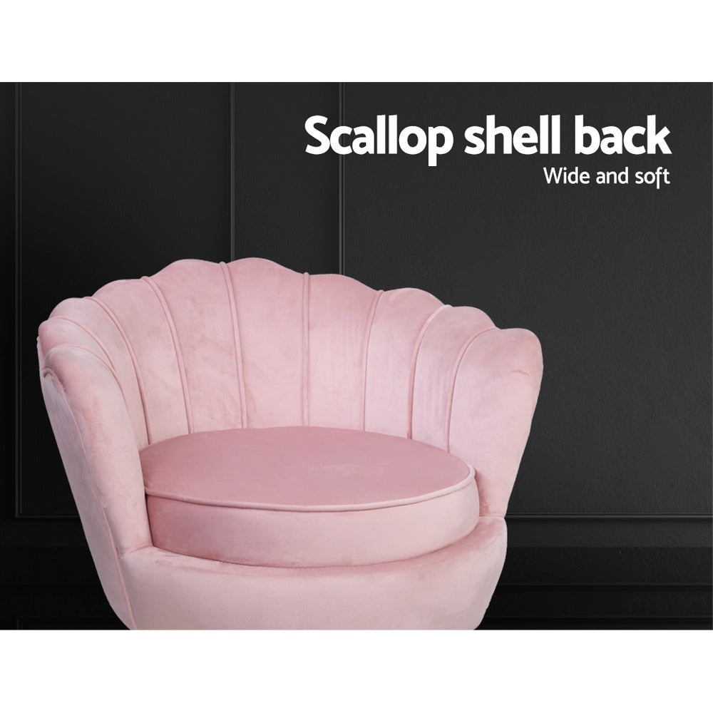 Pink velvet scallop chair close-up against dark background showing channel-stitched back with Scallop shell back text