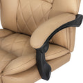 Close-up of tan PU leather diamond-stitch chair back with black flip-up armrest pivot joint on white background